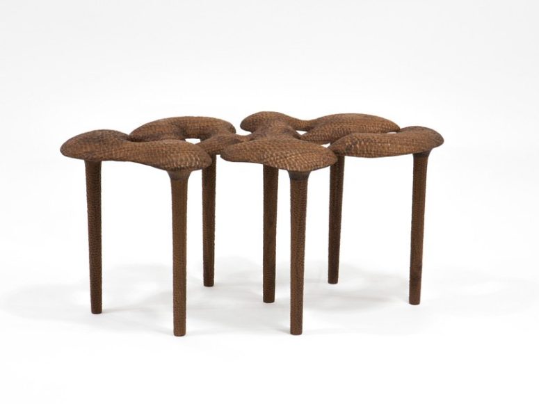 This is a carved out bench that looks like unique trees somewhere in Africa