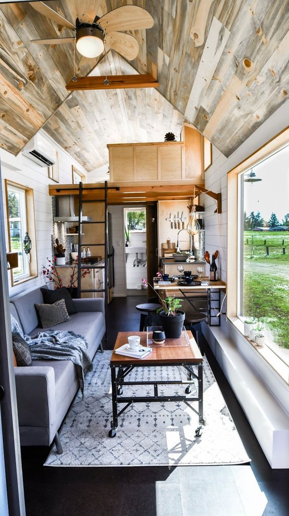 furniture on casters, sleeping space on the second level, wall-mounted dining tables help to get more of the space
