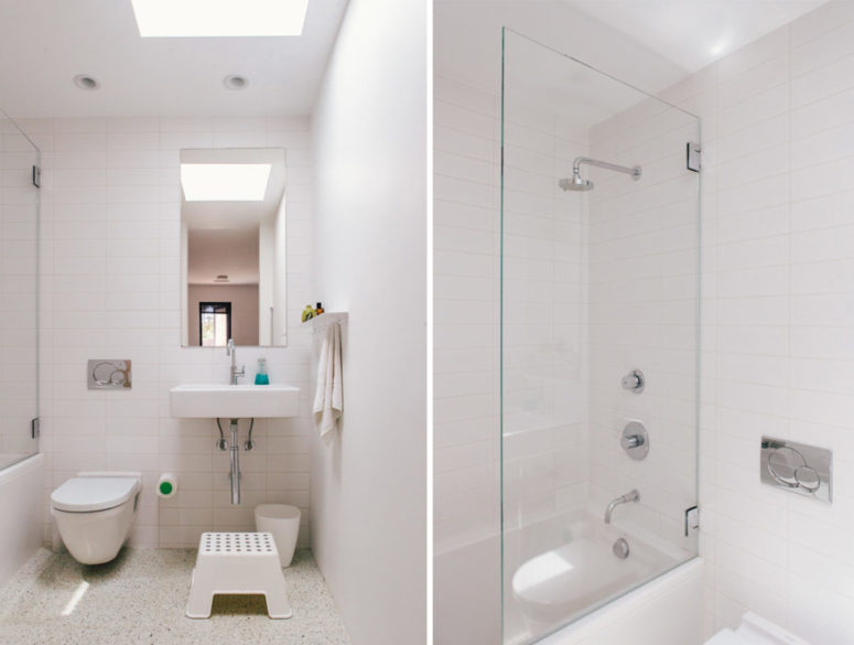 The bathroom is done in white, too, and the floor features a pattern, colorful touches add interest