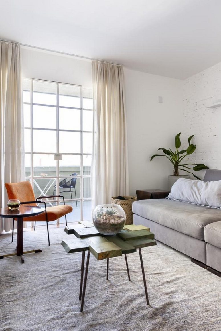 living room design with a creative coffee table The living room features some comfy furniture, a bright orange chair and a quirky coffee table