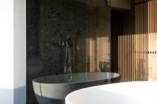 06 a contemporary space with a shower enclosed in smoked glass makes it separated and bolder