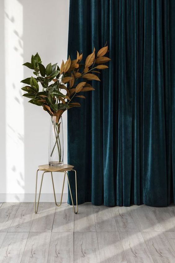 velvet drapes in such a bold color, teal, will add not only texture but also much color to the space