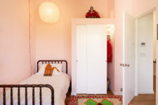 08 The kids’ space is done in pink, with a comfy wooden bed, a colorful rug and much light to make it welcoming