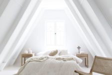 08 a totally white attic bedroom with wood and wicker touches that make it very cozy