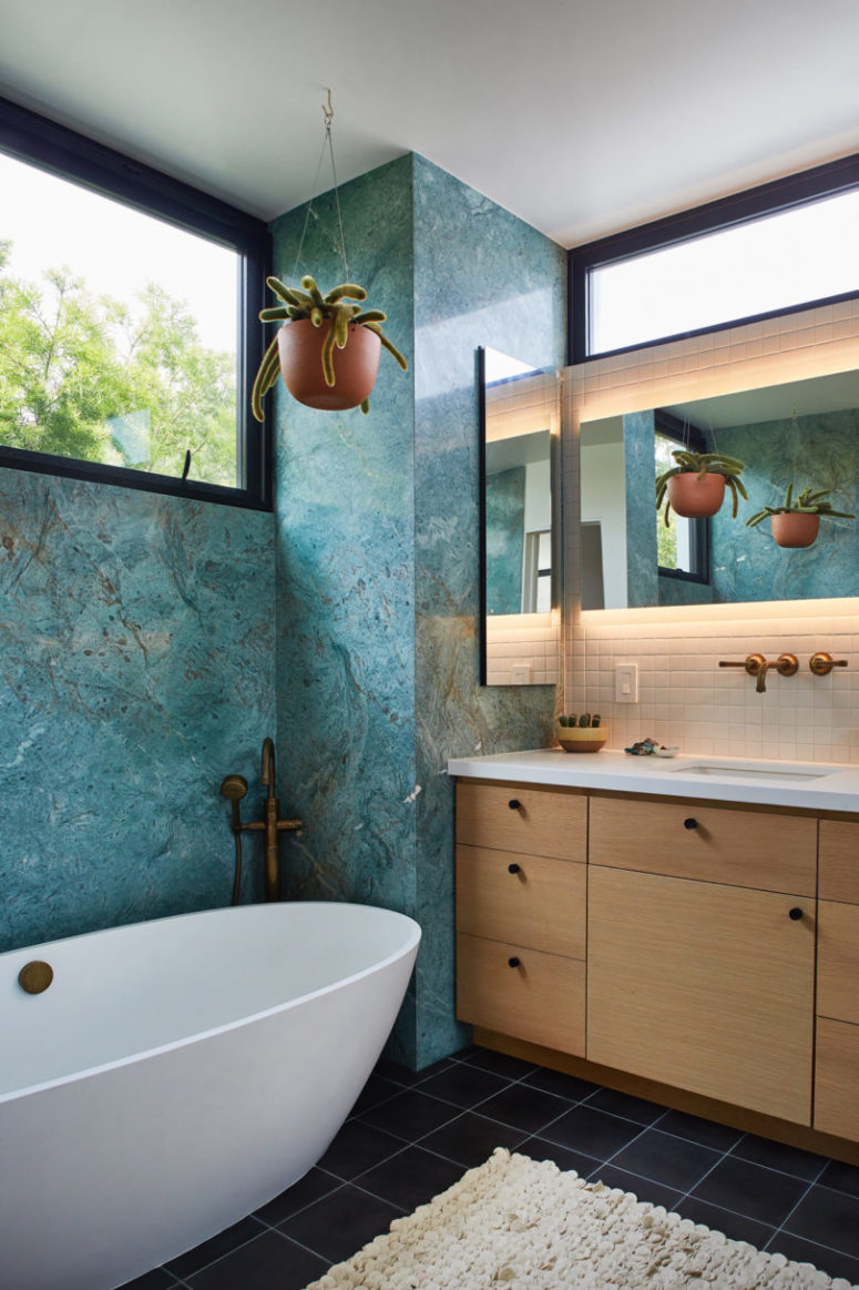 The bathroom also features a wooden vanity and white tiles over it