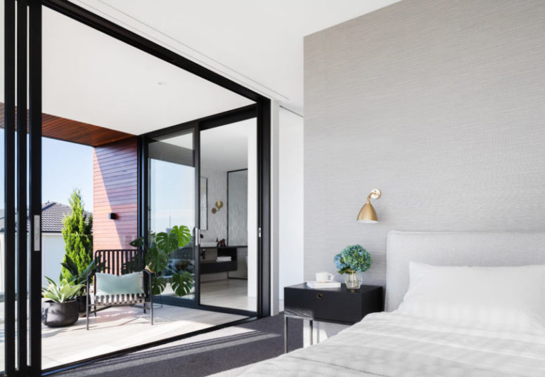 The master bedroom is opened to a large balcony and there's an en-suite bathroom