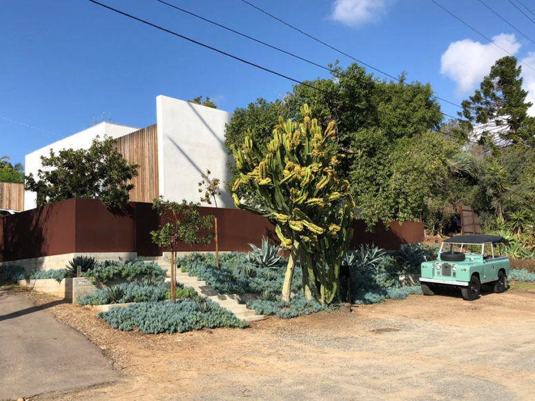 The house features walls around to keep it private