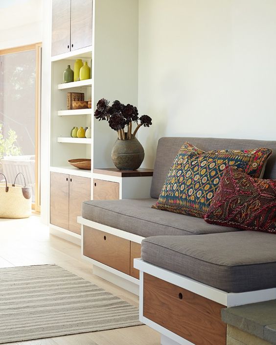 a built-in seating with storage drawers is a nice idea for a kitchen, it's a ready breakfast nook with storage