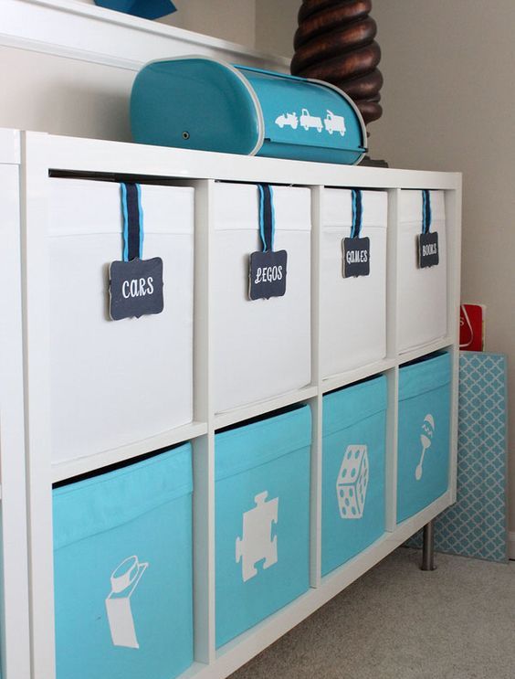 a kid's furniture piece completed with IKEA Drona boxes, with labels and chalkboard markers