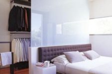 a small walk-in closet in a bedroom