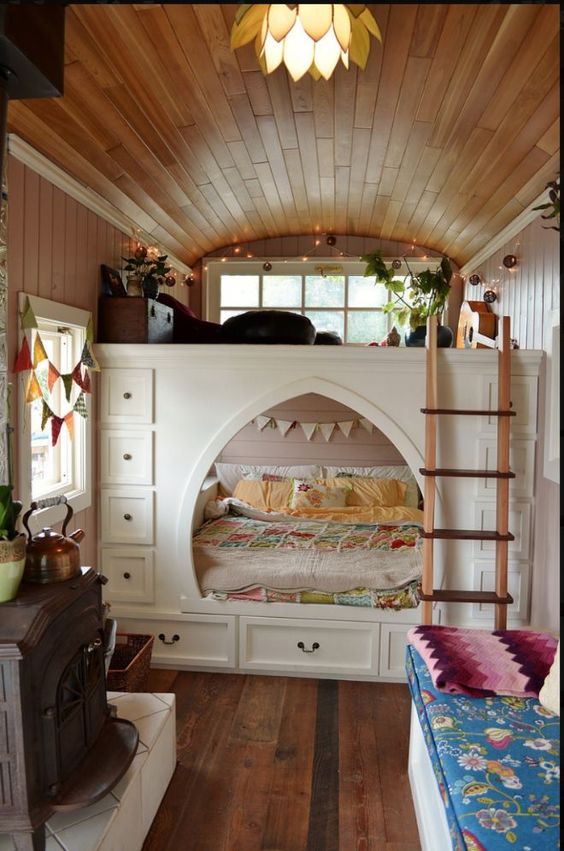 a smart built-in bed with additional storage drawers on each side is a cool way to go