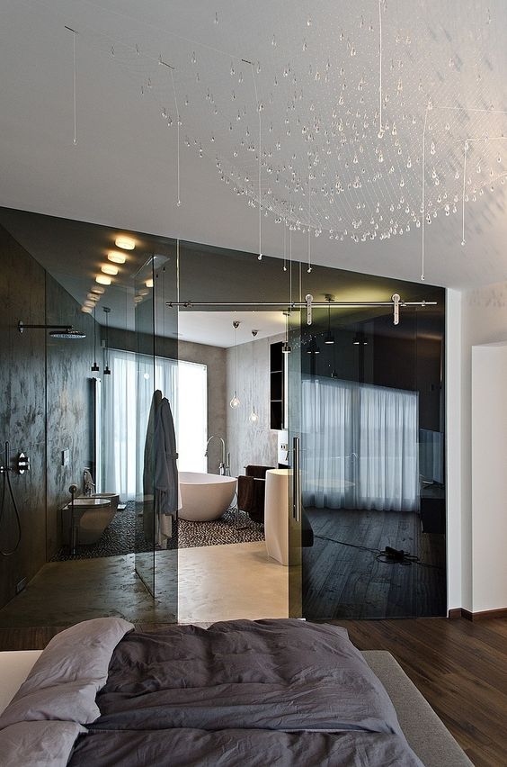 separate the en-suite bathroom from your bedroom with smoked glass doors to keep both spaces light-filled and connected