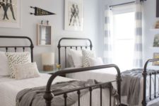 15 a neutral guest bedroom with two beds and touches of vintage here and there