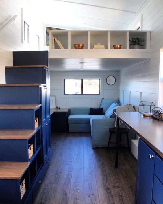 additional storage units incorporated into the staircase, over the living room