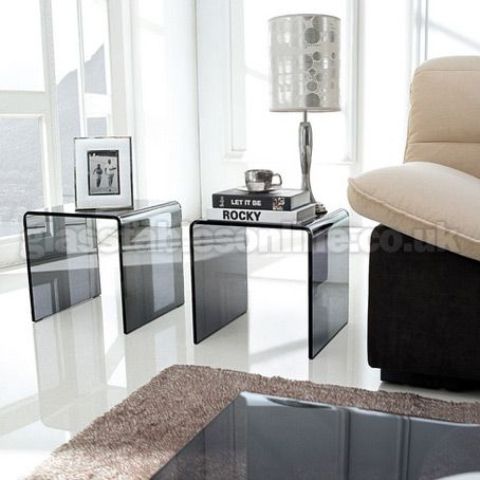 a pair of smoked glass side tables is a bold idea for every modern living room