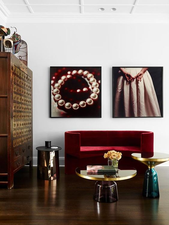 a gorgeous curved burgundy coach features two trends at the same time