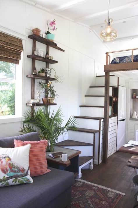 an open shelving unit allows using an awkward corner between the ladder and the sofa
