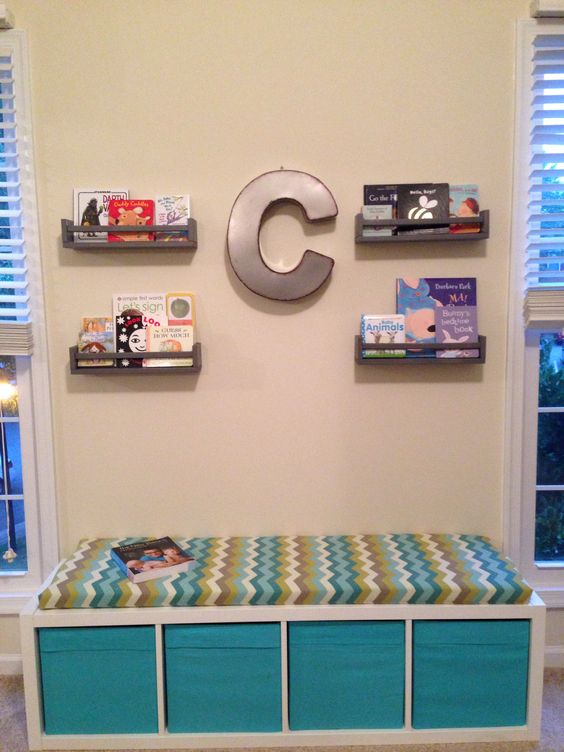 an upholstered bench from IKEA with Drona boxes for storage is a cool and comfy idea