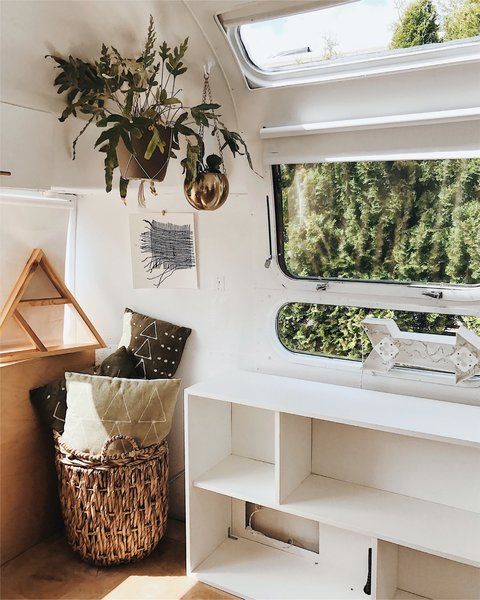 an open shelving system under the window is a great piece to use for storage
