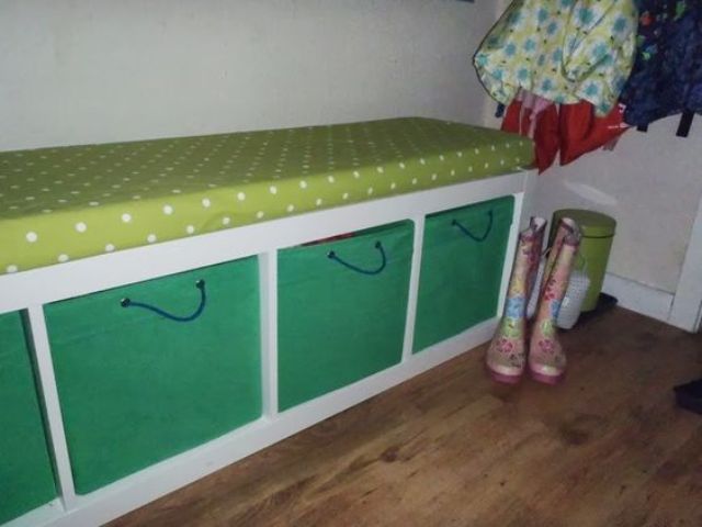 an upholstered bench with Drona boxes with cord handles added for more comfort