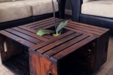 20 a creative coffee table with plenty of storage made of several dark stained IKEA Knagglig boxes