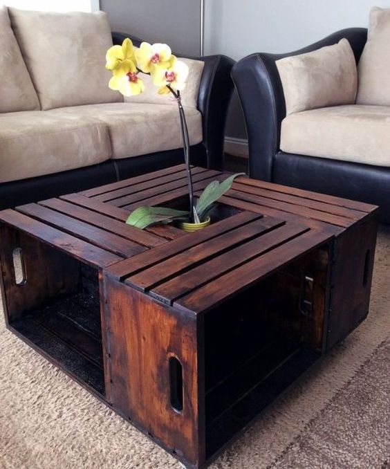 a creative coffee table with plenty of storage made of several dark stained IKEA Knagglig boxes