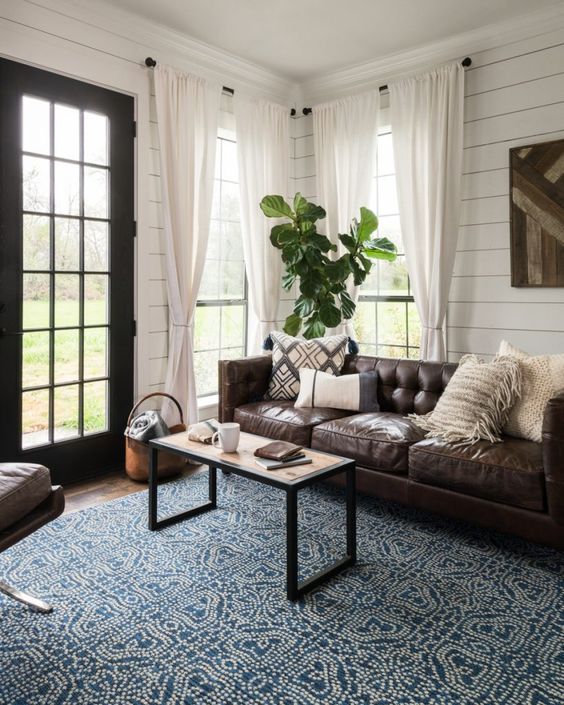 add color and texture to the living room with such a blue and white patterned rug