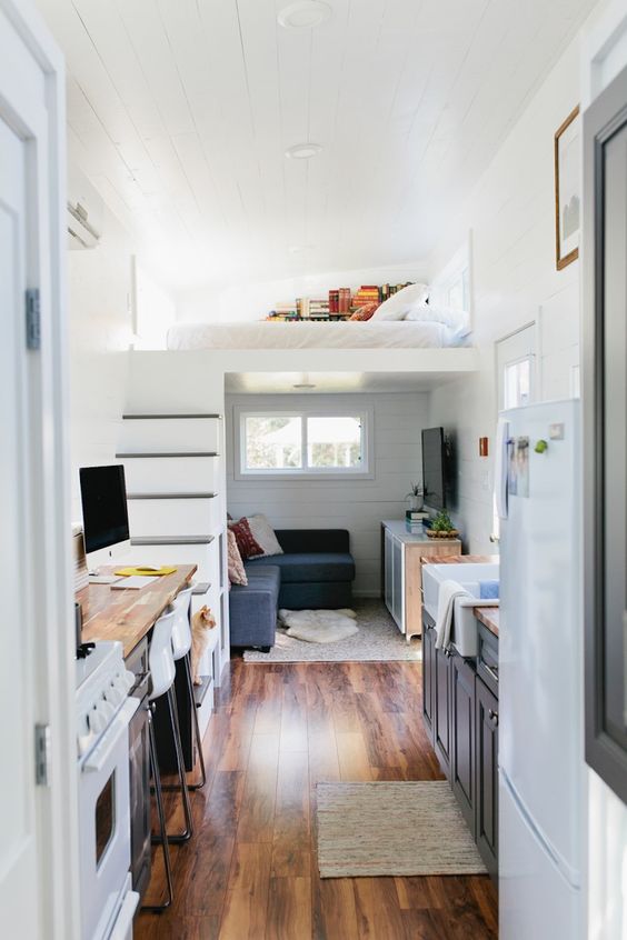 rugs in each space are cozying up accessories that don't clutter the rooms