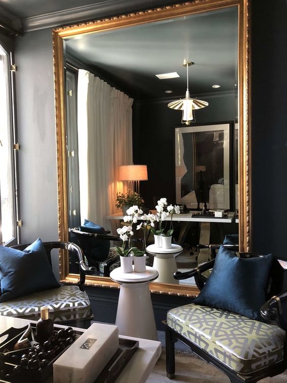 if you don't have a fireplace, why not rock an oversized mirror in the sitting nook instead