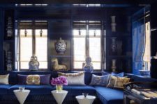 02 a bold and exquisite living room in electric blue spruced up with a gold ceiling and gold touches