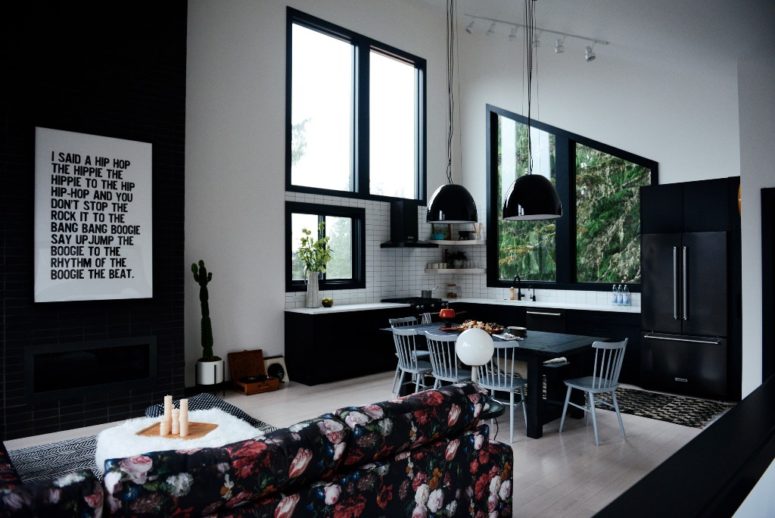 fur covers could always add texture to any interior This space seamlessly flow in the living room with a black fireplace, a moody floral sofa and a fur ottoman
