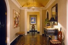 03 a bold mid-century modern foyer with a metallic arched ceiling and a bold chevron floor