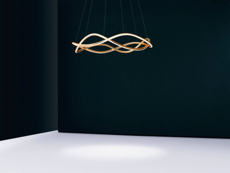 The lamp is available in matte gold, satin black, or bronze finishes and other finishes on order