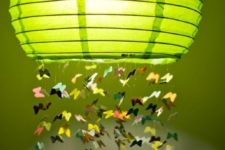 04 a colorful Regolit lampshade with some paper butterflies attached is a whimsical decoration