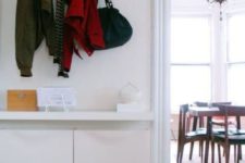 06 IKEA Trones storage boxes and a tabletop attached over them for a minimalist entryway