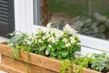 07 a cedar window box planter with much greenery and white flowers looks cute and rustic