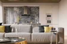 07 a contemporary living room is spruced up with a gorgeous gold ceiling with a geometric design and gold furniture