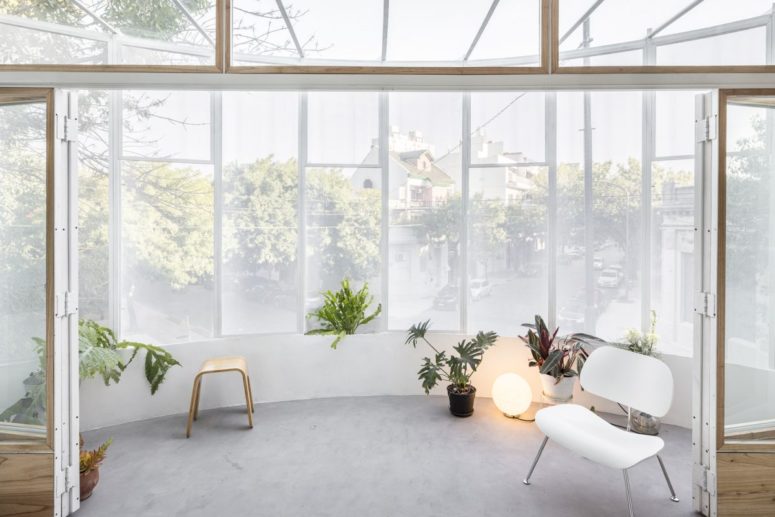 an awesome sunroom like balcony design The balcony can be styled with some furniture and lots of potted greenery for a fresh look