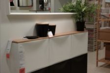08 a chic black and white IKEA Trones cabinet with a wooden tabletop as a floating entryway console