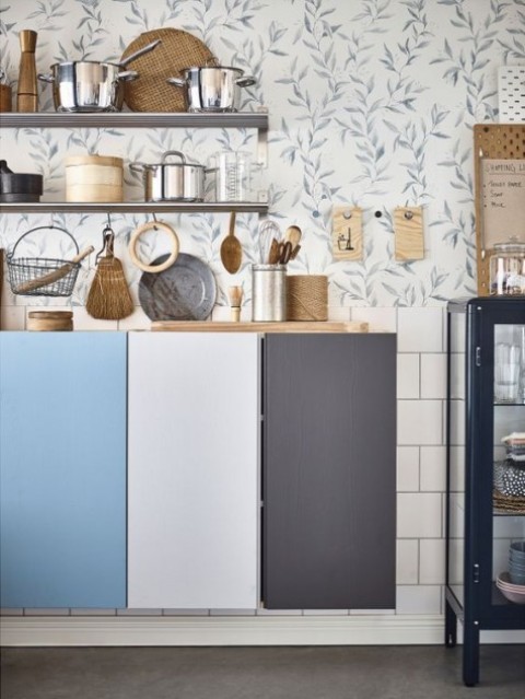 floating IKEA Ivar cabinets to comprise a kitchen, each door painted a different color