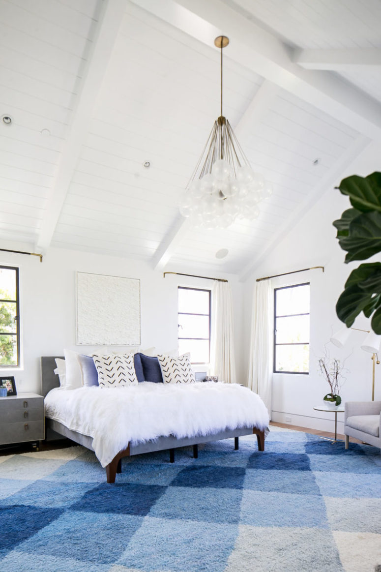 The master bedroom is very chic and cozy, done in blue and white with lots of texture done with textiles The master bedroom is very chic and cozy, done in blue and white with lots of texture done with textiles