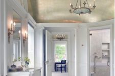 09 a beautiful traditional bathroom done with white marble and with a shiny gold domed ceiling