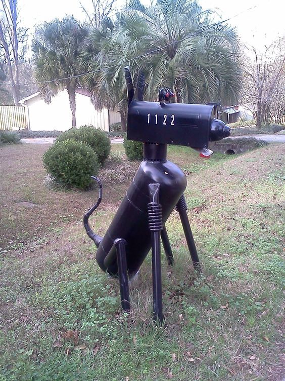 a black industrial dog mailbox is a bold and cathcy idea with a contemporary and industrial feel