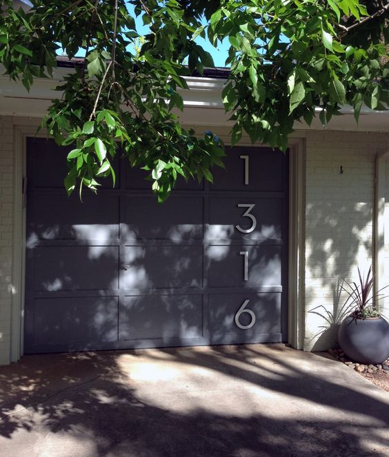 house numbers placed on the gate is a cool and bold idea that attracts attention