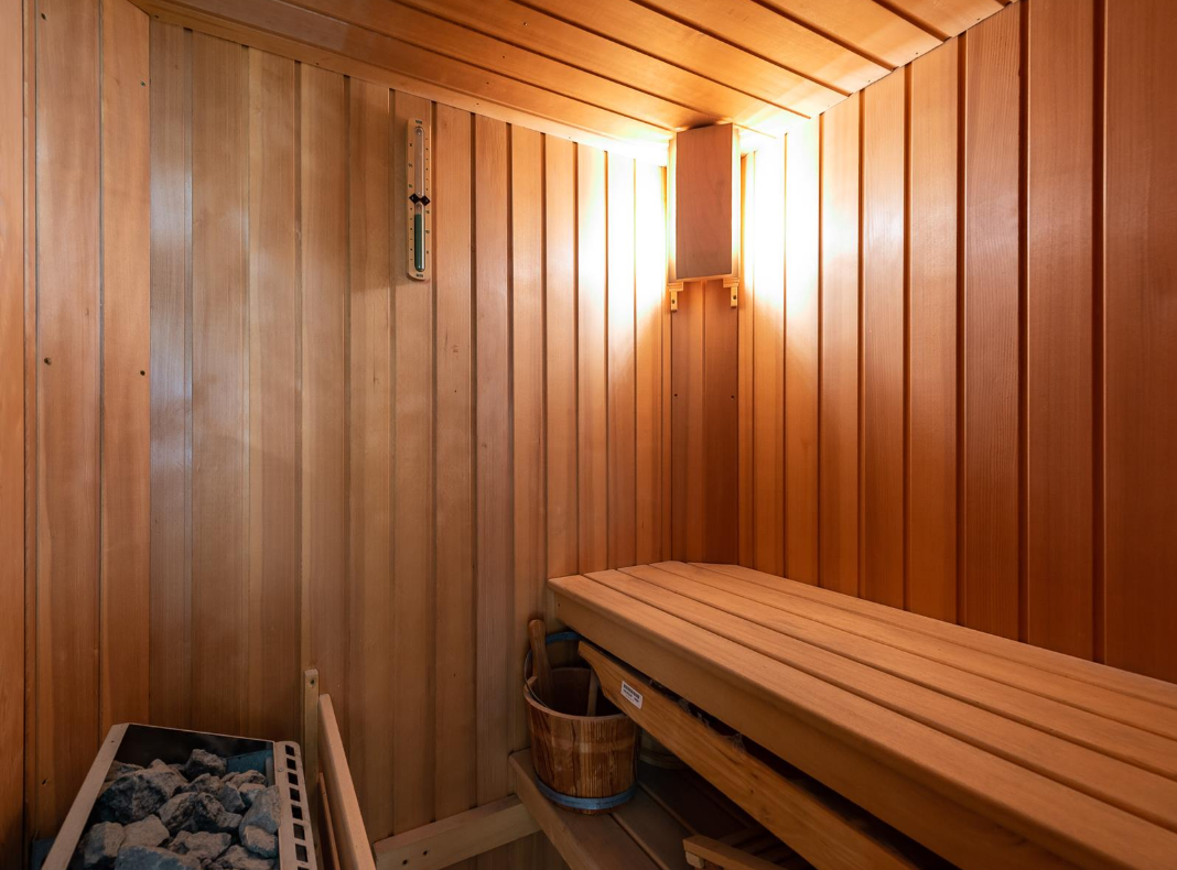 The bathroom includes a sauna for full relaxation
