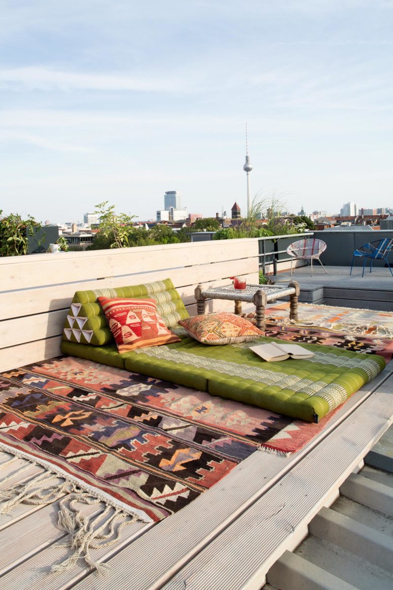 The terrace features a boho space for relaxing and a sitting space