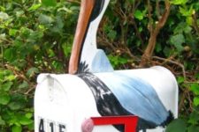 10 a bright pelican mailbox with house numbers is a cool idea for a coastal or beach home and it looks veyr eye-catchy