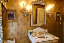 11 a gorgeous and refined powder room with a gold ceiling and gold furniture legs and faucets
