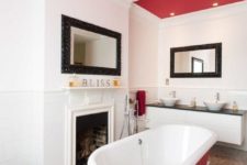 11 a hot red ceiling and an echoing bathtub make the space bold and add personality to it at once