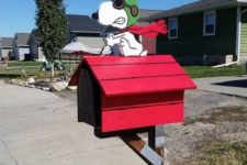 12 a hot red mailbox with a fun toon doggie is a whimsy and quriky idea that will catch an eye every time